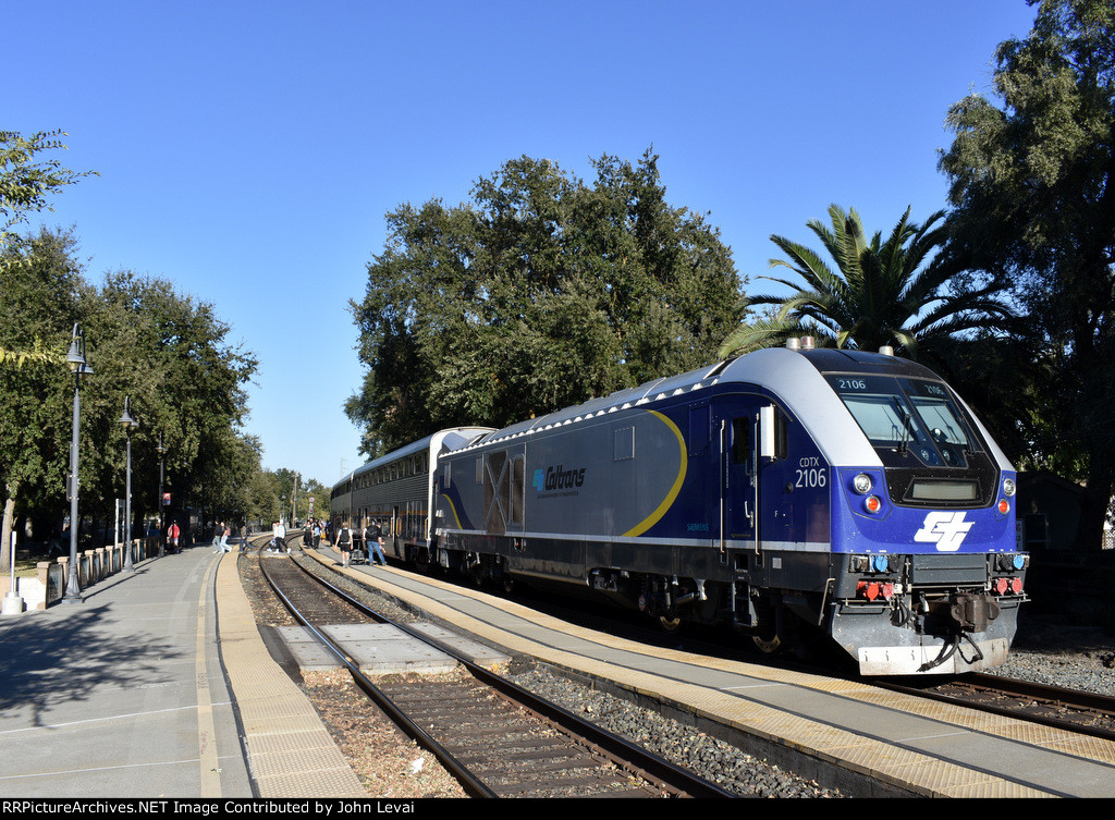 Charger # 2106 is on the rear of Amtrak Capitol Corridor Train # 734 as it discharges passengers at Davis Station